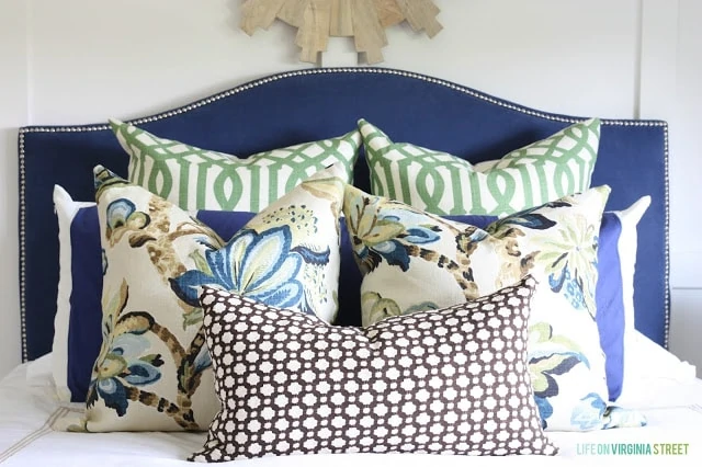Multi coloured blue pillows in the guest bedroom.