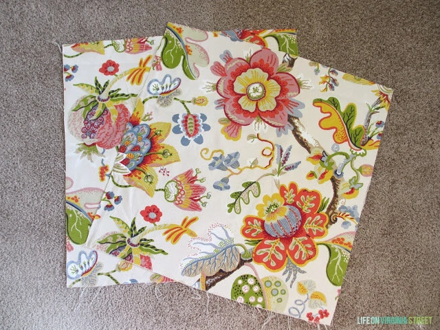 Swatches of floral fabric on the ground.