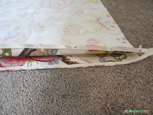 The pillow half done on the rug.