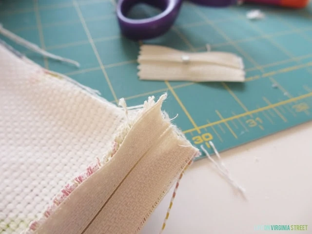 The cut end of the zipper.