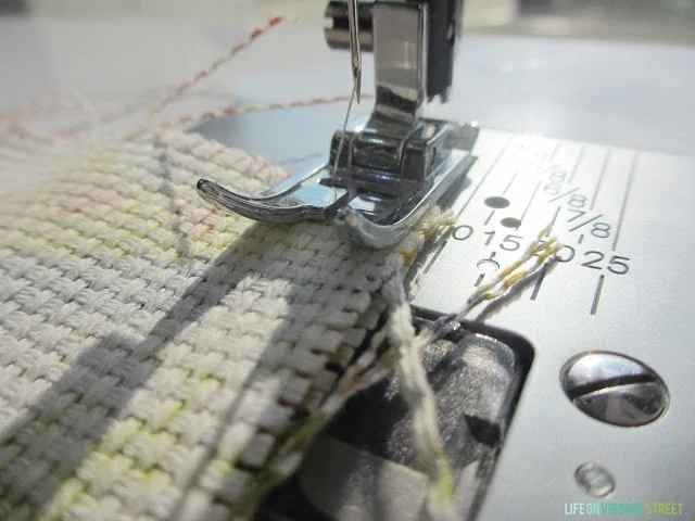Sewing all three sides of the pillow together.