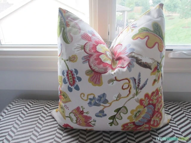The stuffed pillow in front of the window.