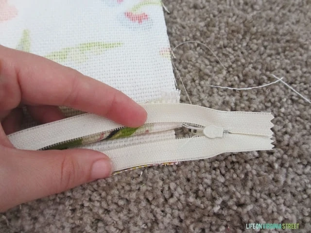 Putting in the zipper.